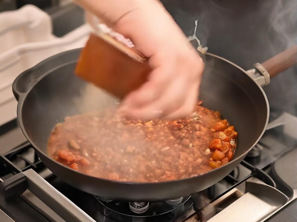 Add 300ml of hot water, then gently place the tofu in the pan.
Simmer over medium heat for 30 seconds, allowing the tofu to absorb the sauce.